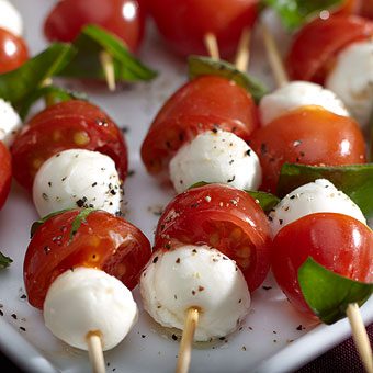 Mozzarella, grape tomatoes, and basil on skewers